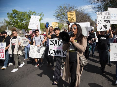 Demonstrators head toward the courthouse on March 29, 2018, during a third-straight day of protests.